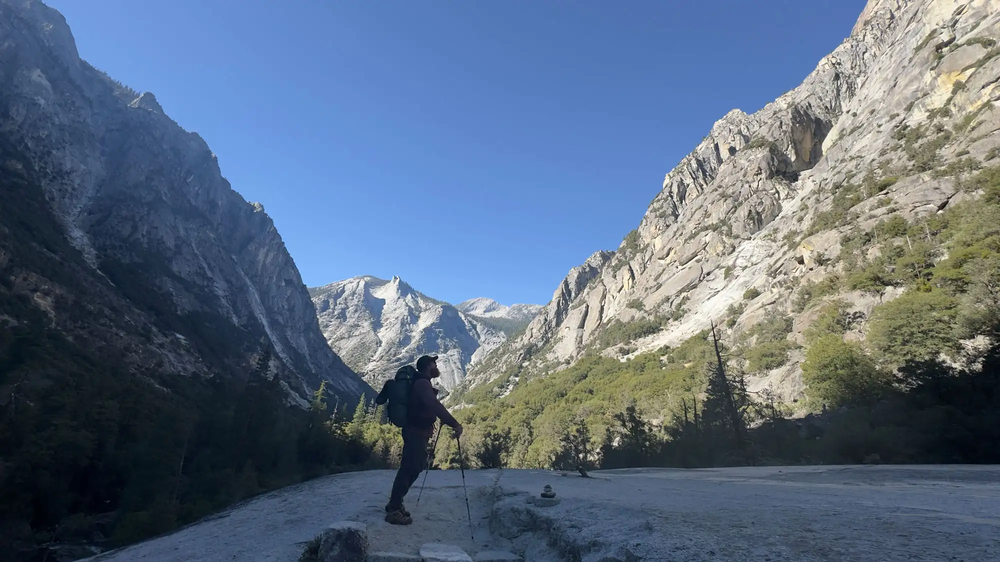 Backpacker looking over a mountain range